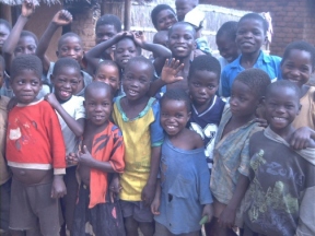 A group of children posing for the camera.